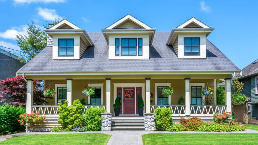 Luxury house with beautiful landscaping on a sunny day